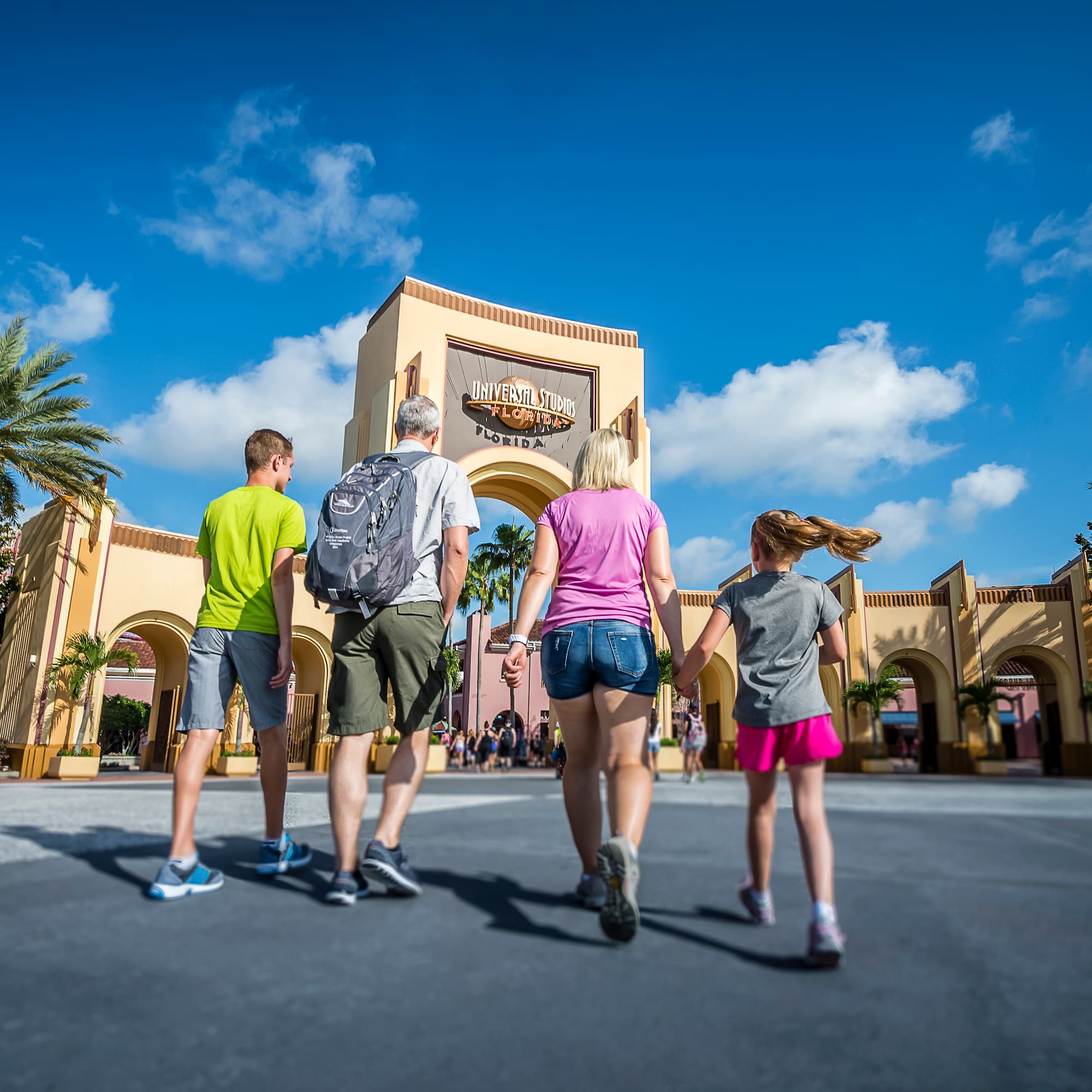 a group of people walking in front of a building