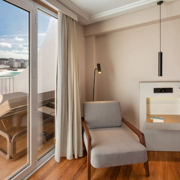 a room with a chair and a glass door