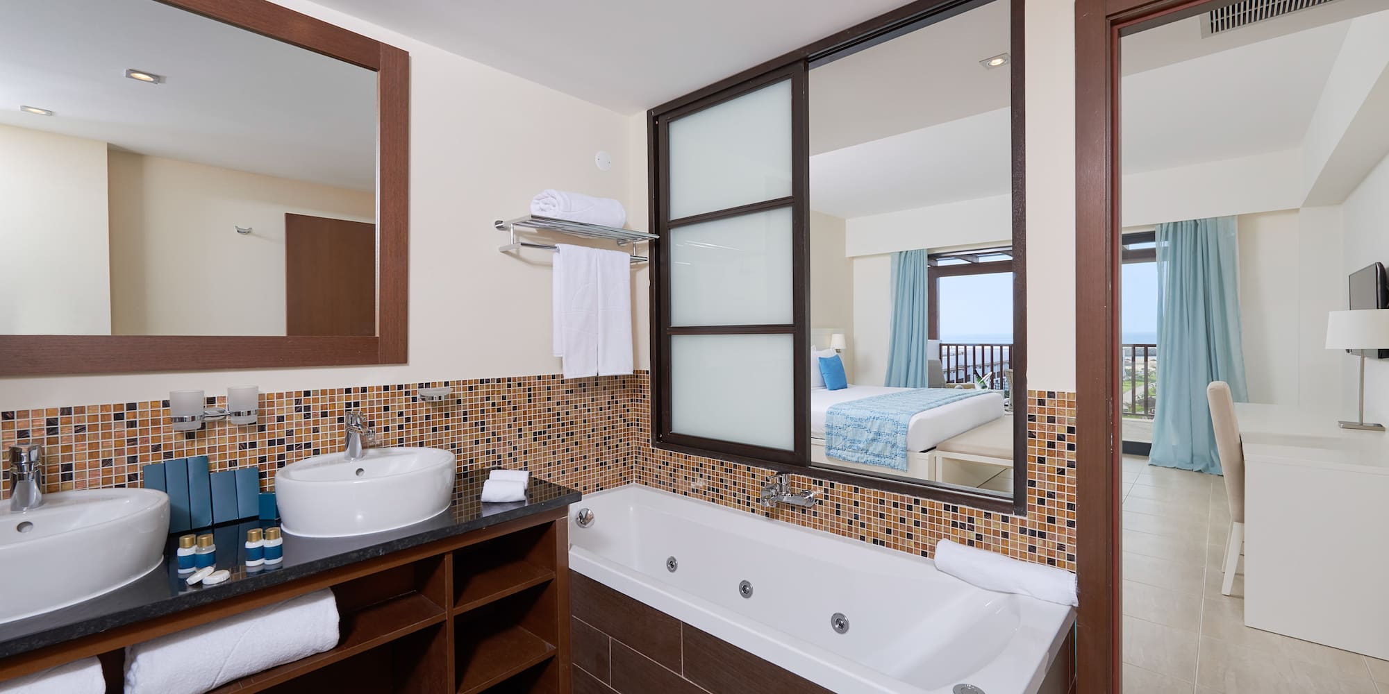 a bathroom with a bathtub and mirror