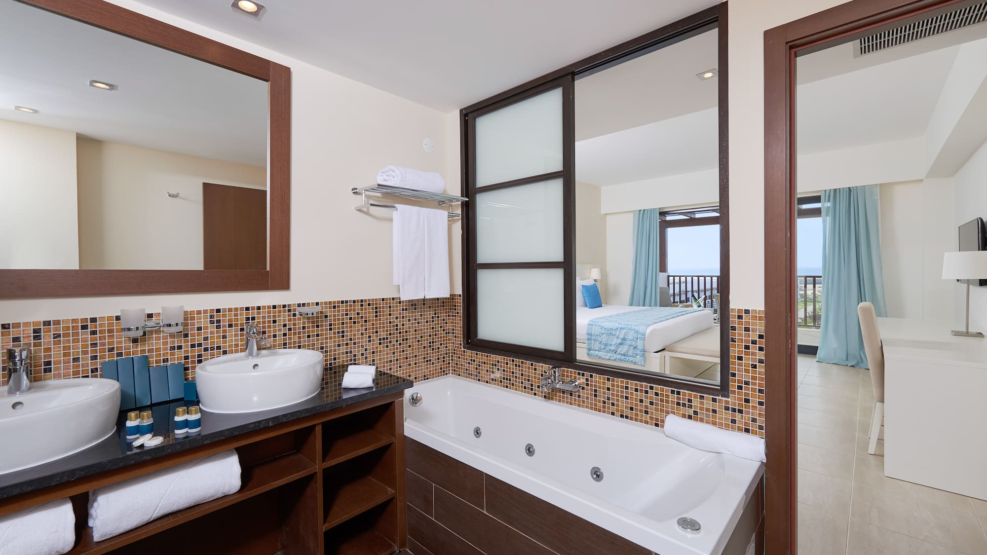 a bathroom with a bathtub and mirror