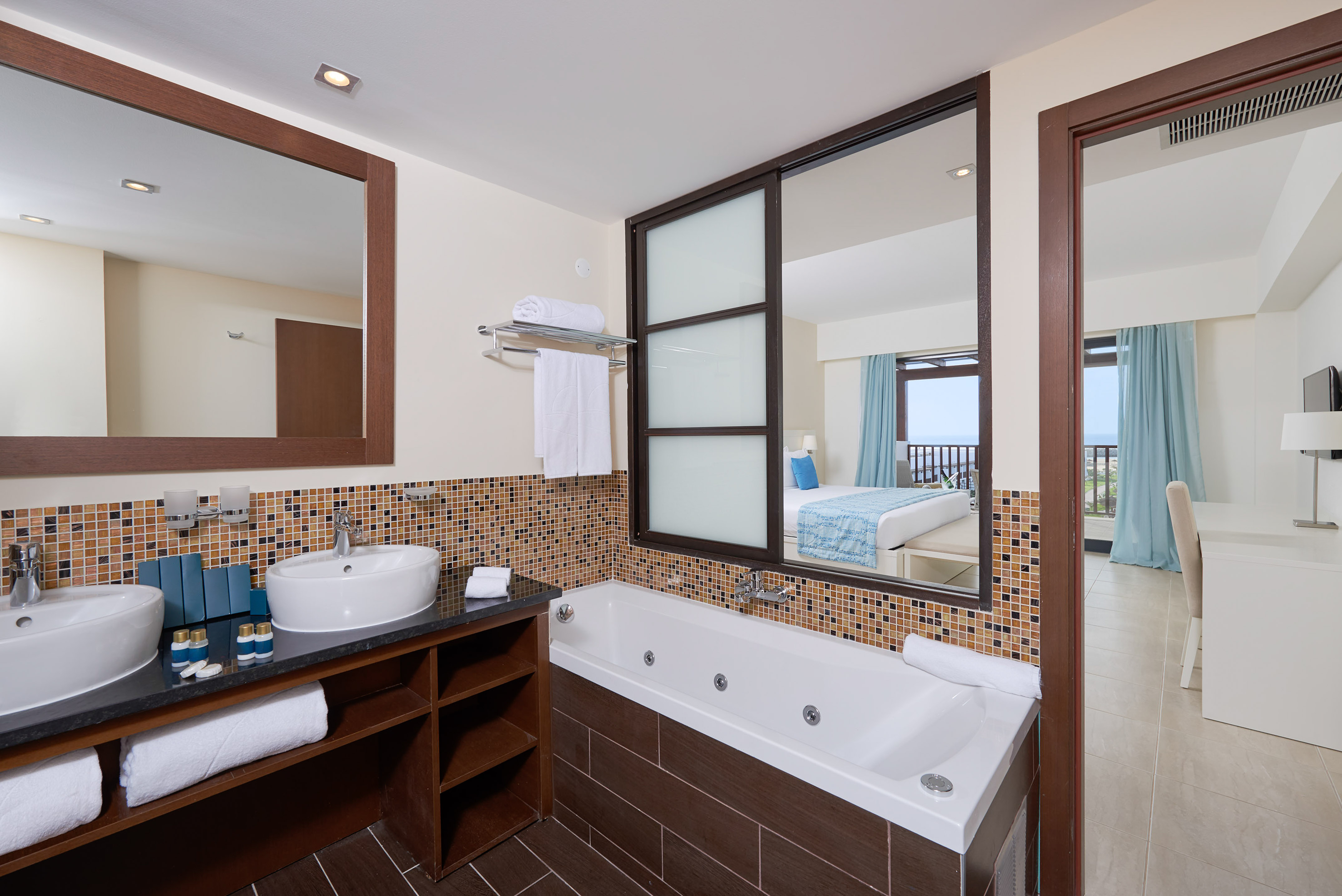 a bathroom with a bathtub and mirror