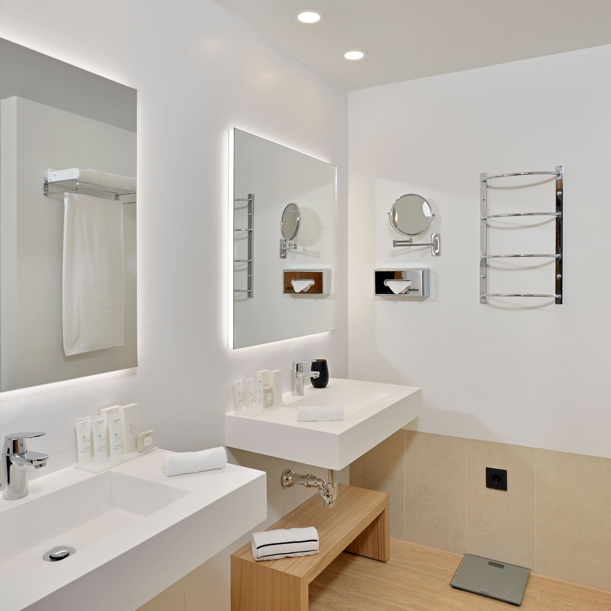 a bathroom with white walls and white countertops