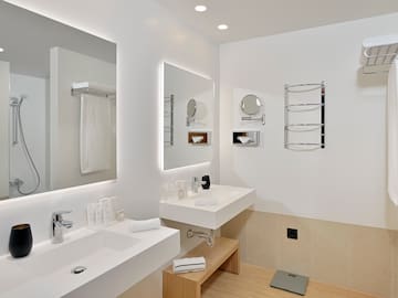 a bathroom with white walls and white countertops