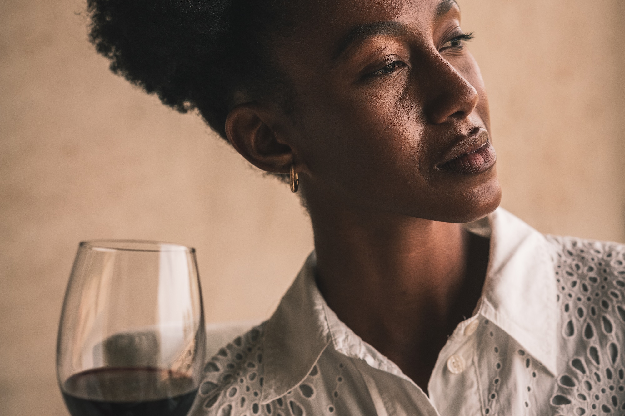 a woman holding a glass of wine