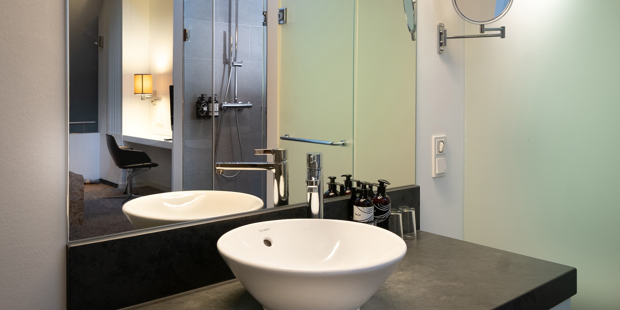 a bathroom with a sink and mirror