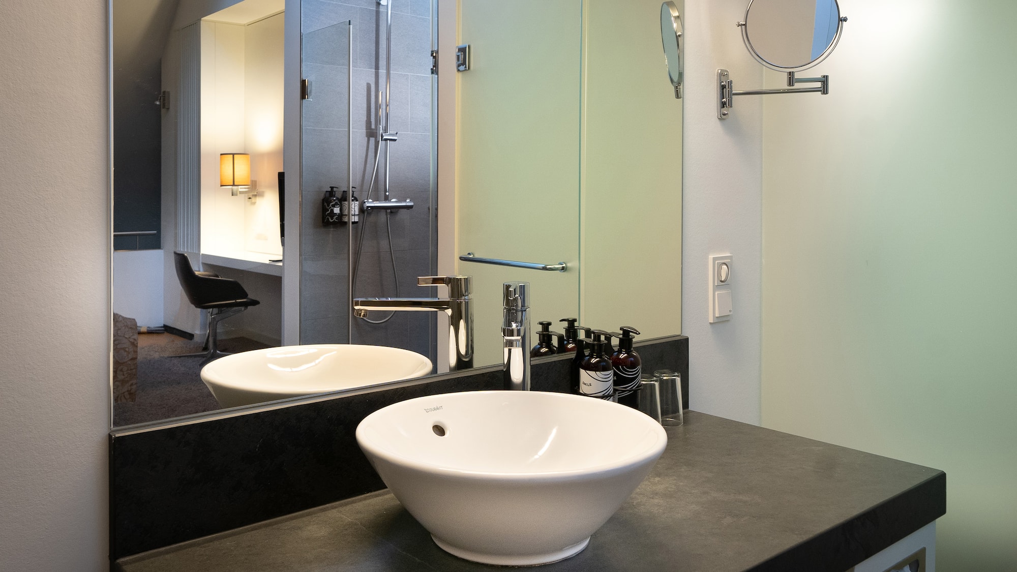 a bathroom with a sink and mirror