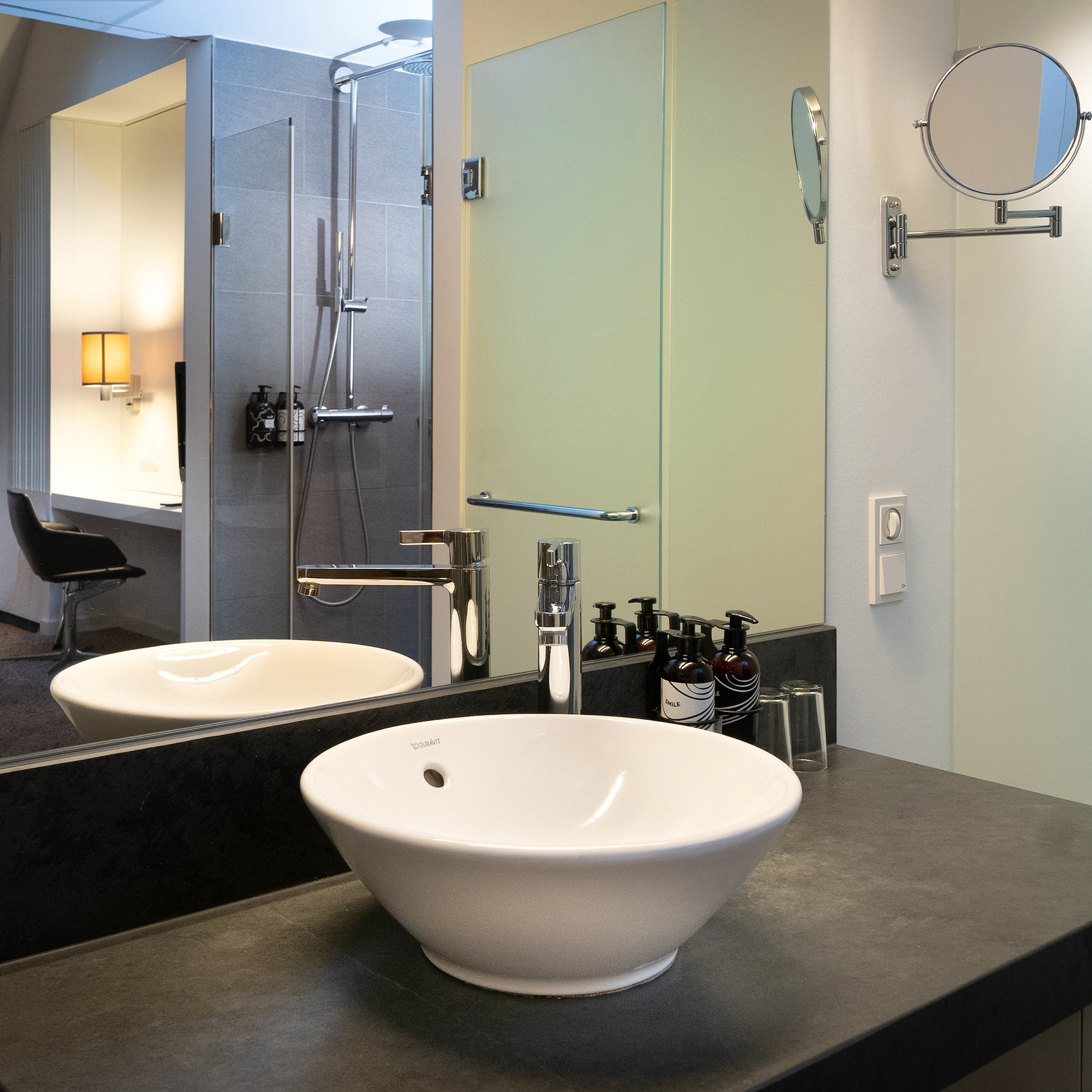 a bathroom with a sink and mirror