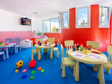 a room with a table and chairs and toys