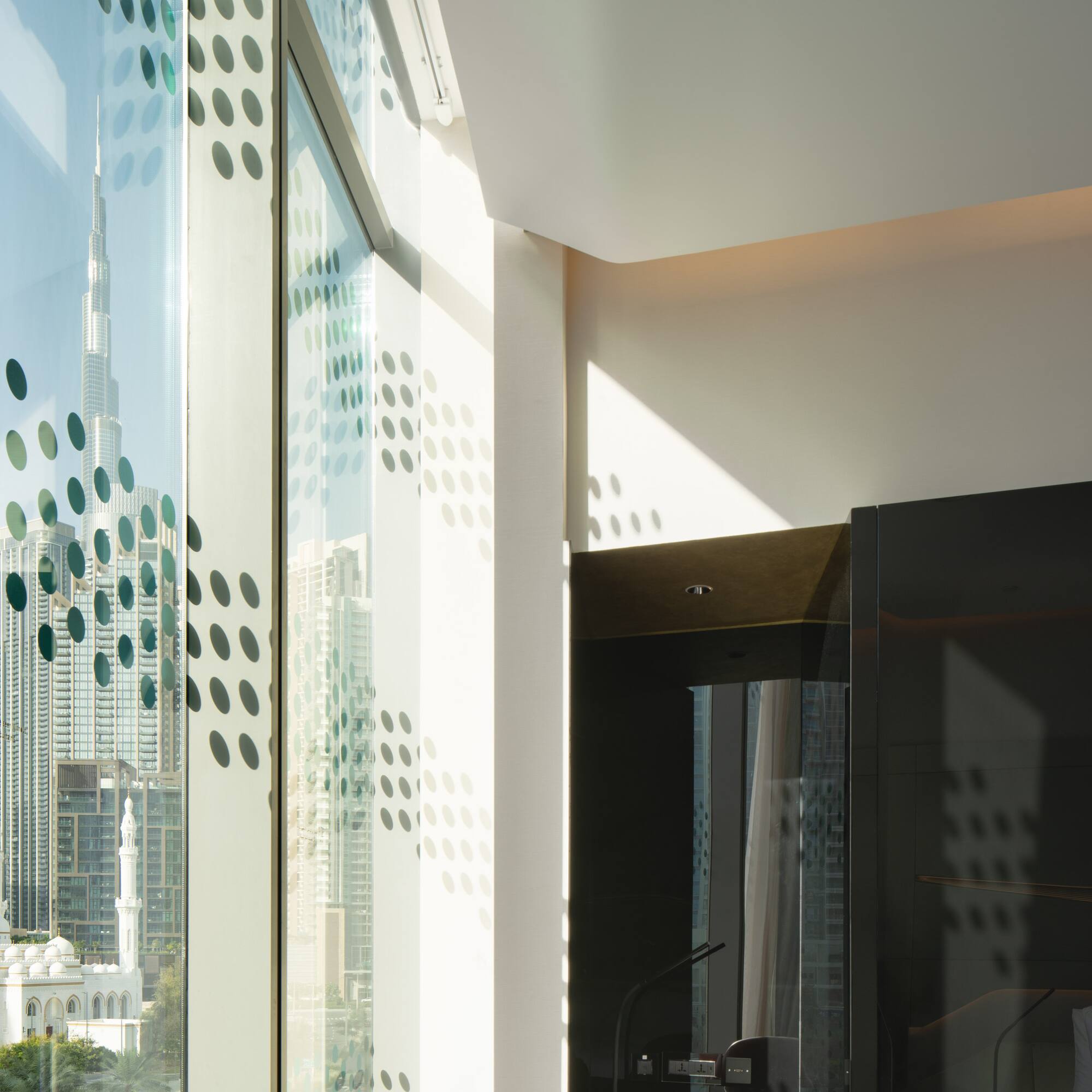 a room with a large window and a city view