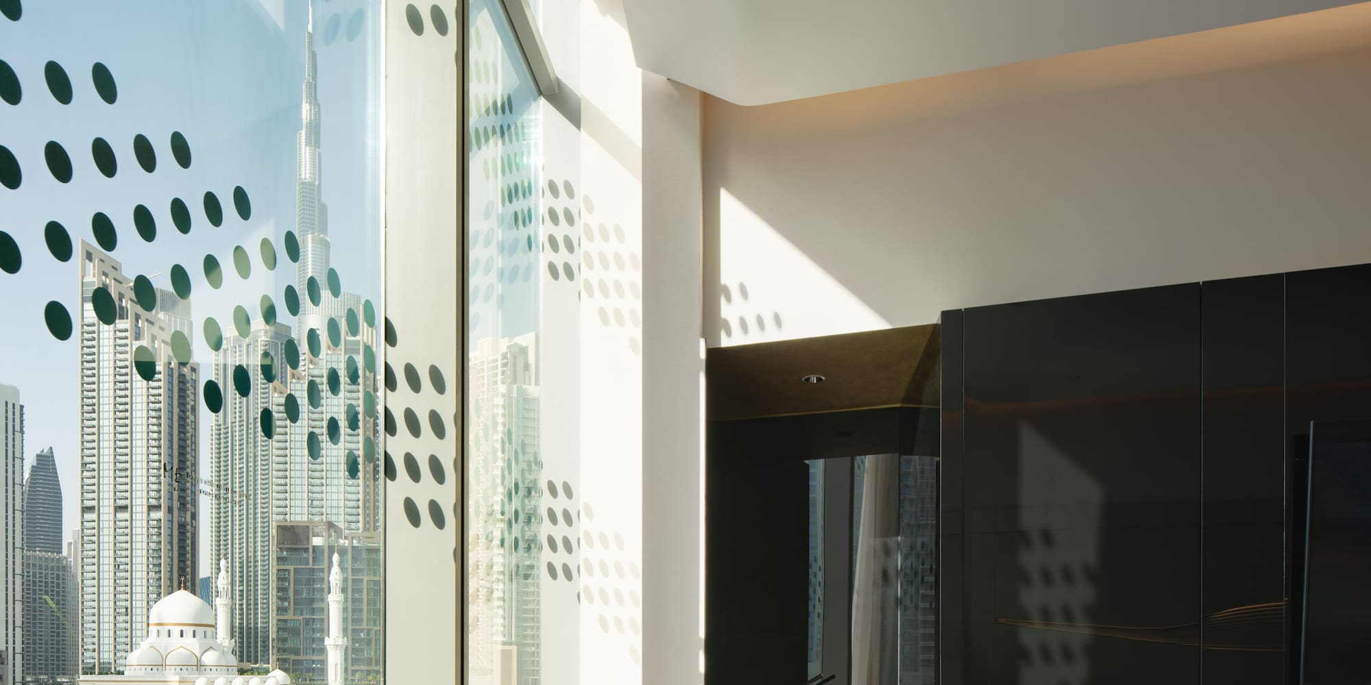 a room with a large window and a city view