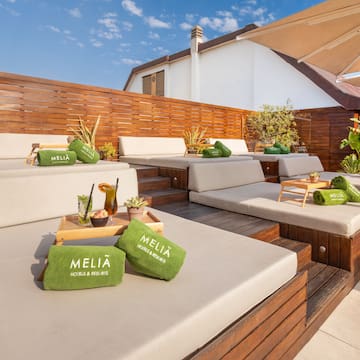 a patio with a table and chairs