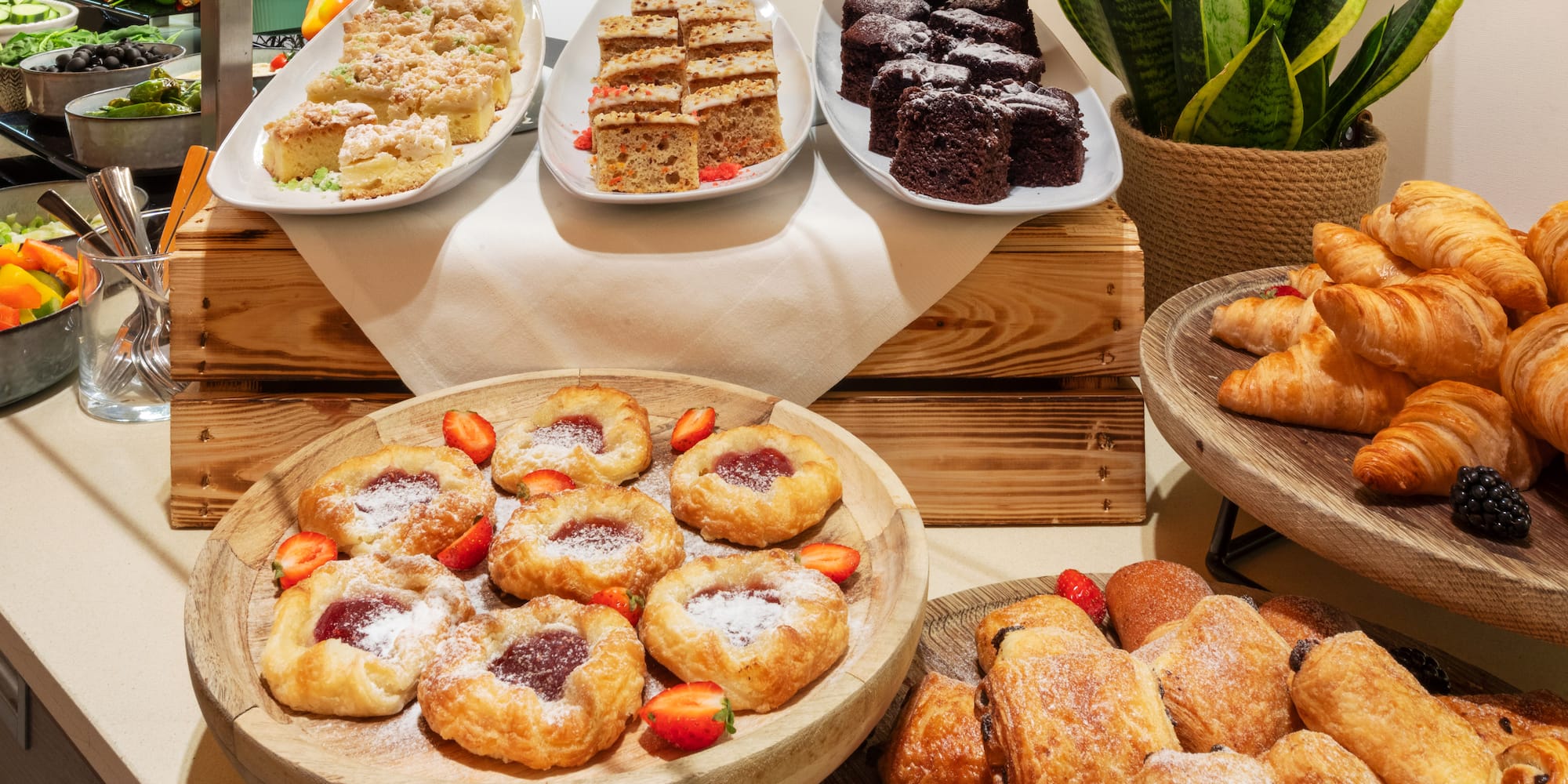 a table with different pastries and desserts
