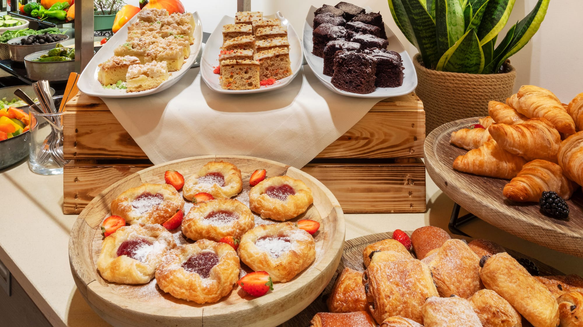 a table with different pastries and desserts