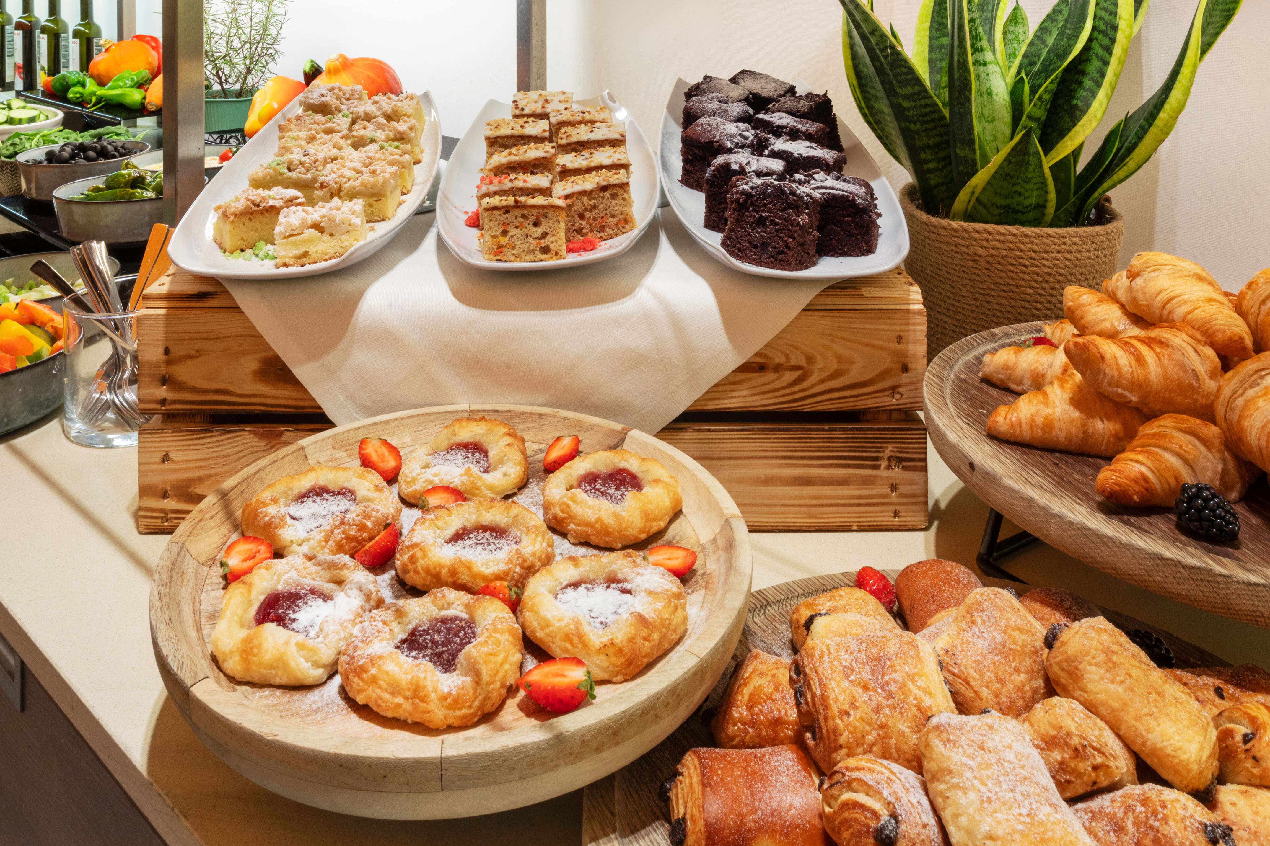 a table with different pastries and desserts