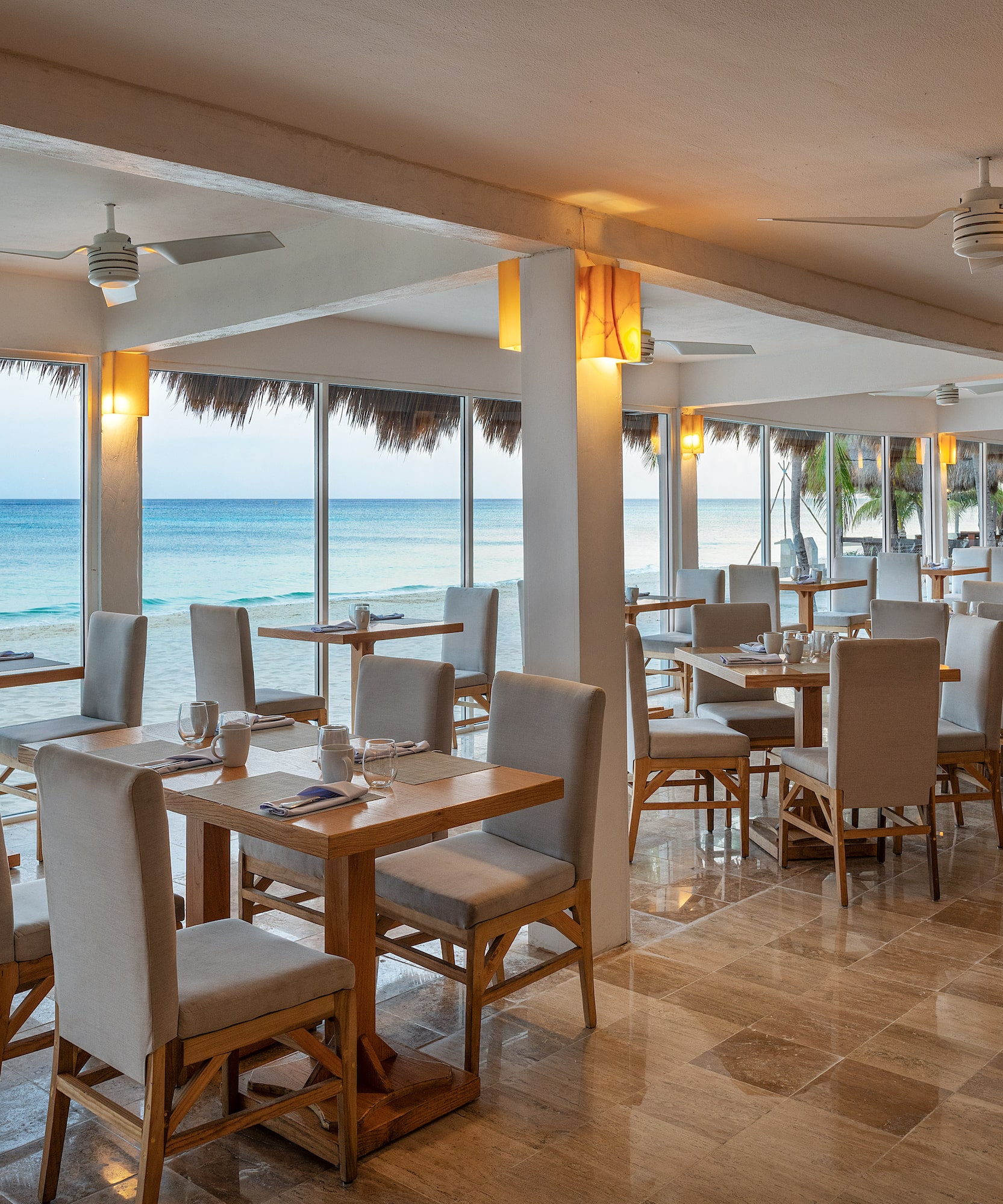 a restaurant with tables and chairs