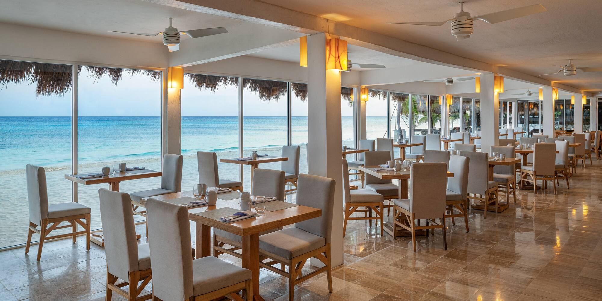 a restaurant with tables and chairs