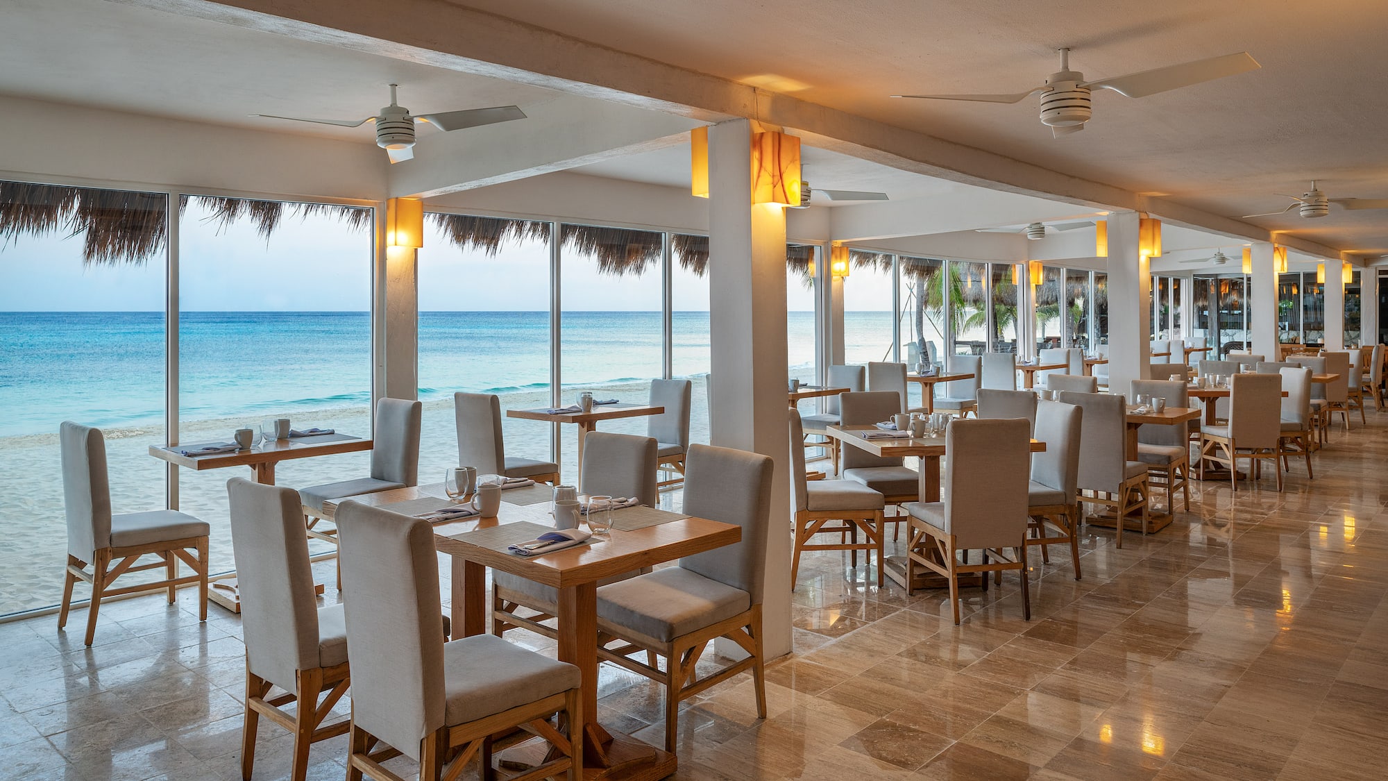 a restaurant with tables and chairs