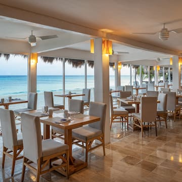 a restaurant with tables and chairs