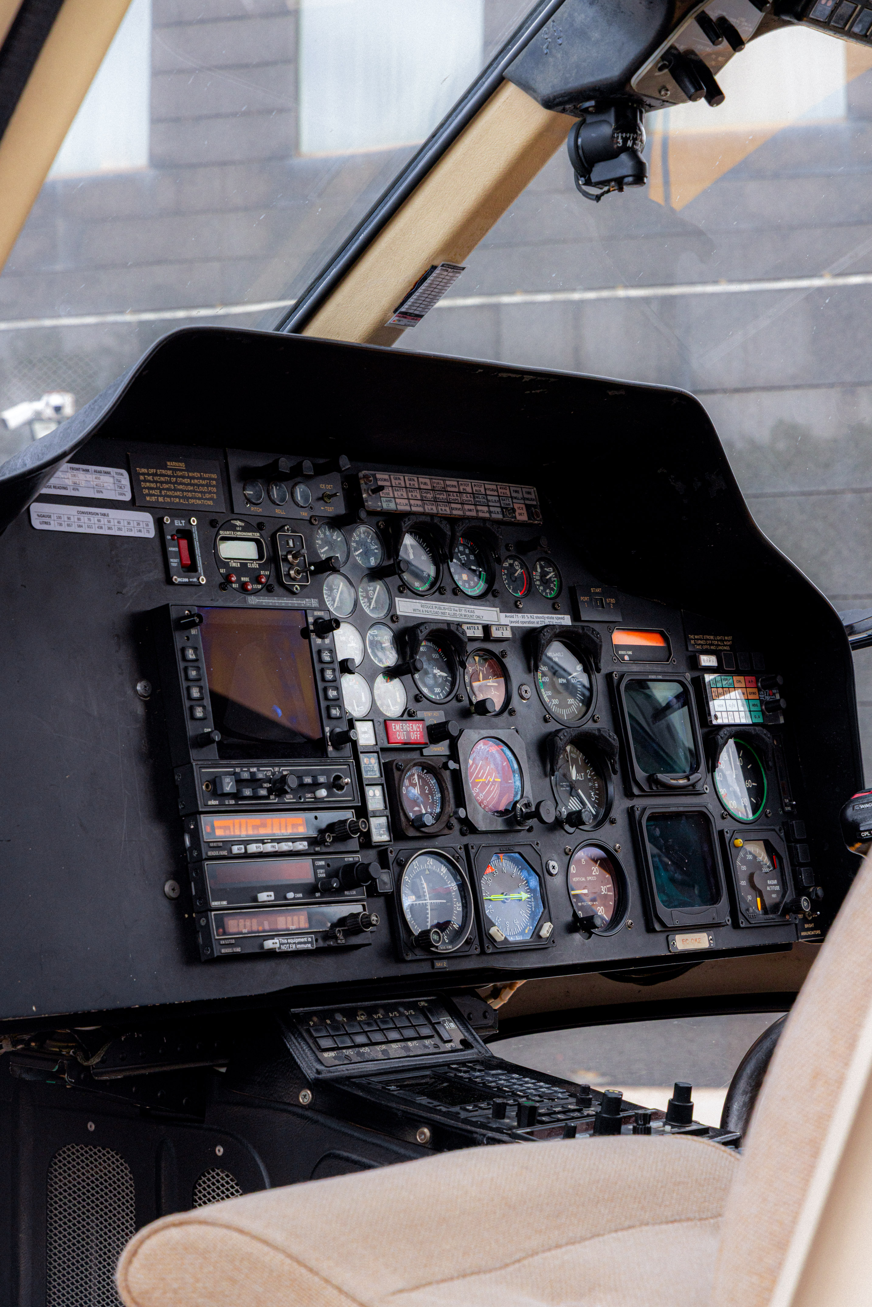 Close-up of a helicopter's detailed instrument panel with gauges and avionics.