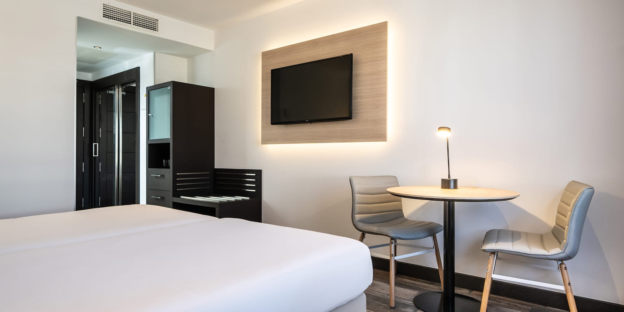 a room with a tv and a table