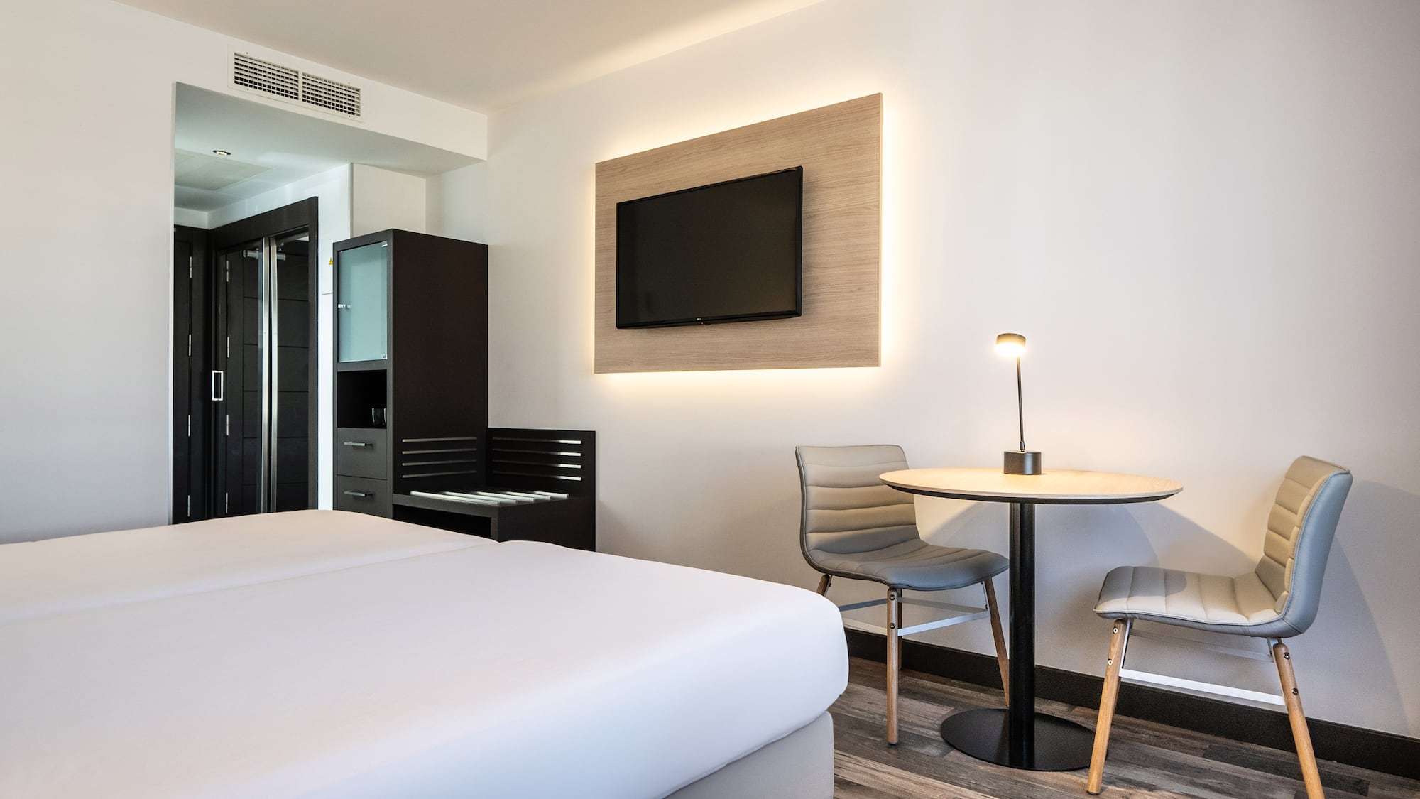 a room with a tv and a table