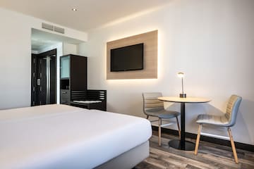 a room with a tv and a table