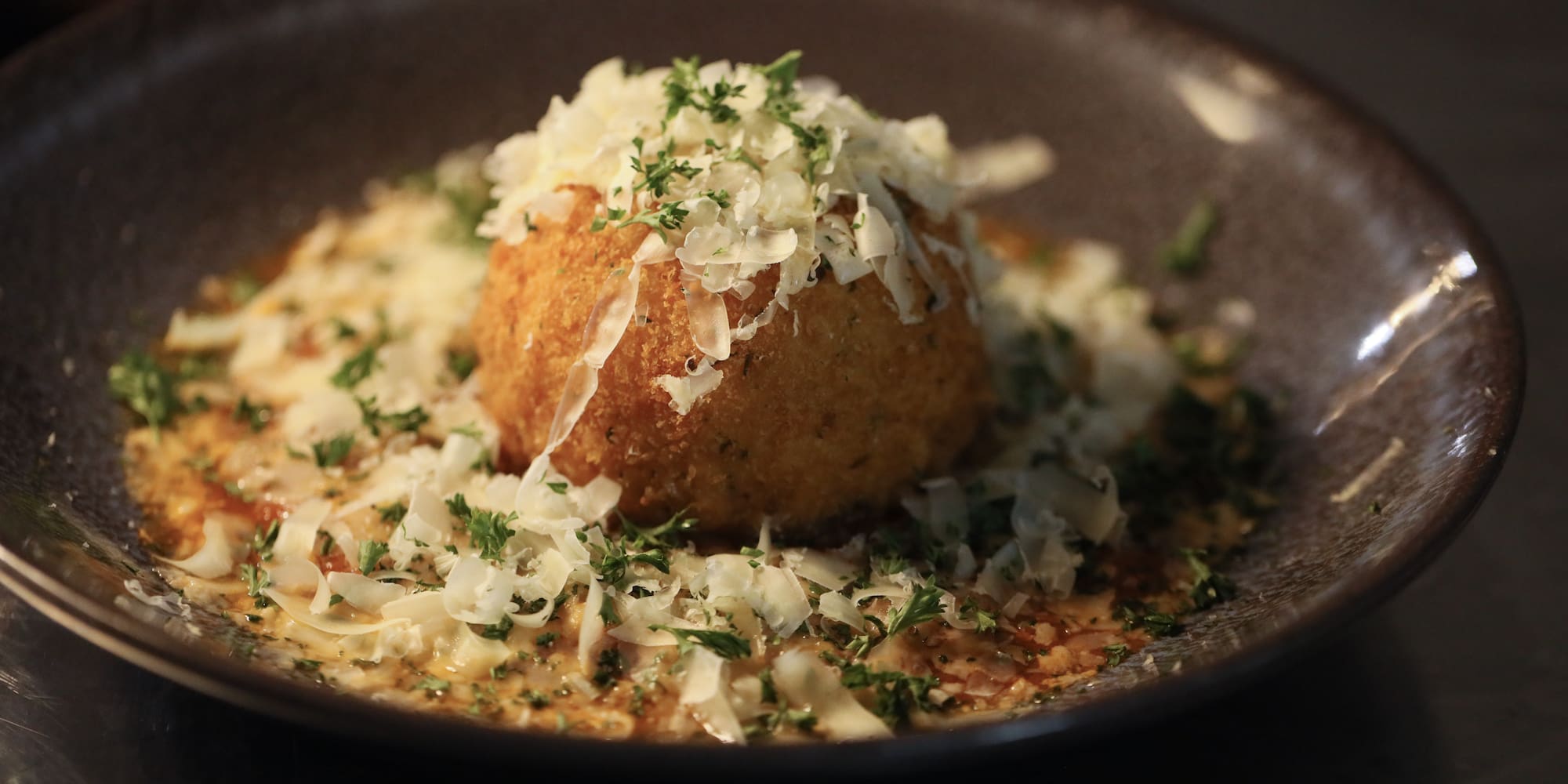 a bowl of food with grated cheese