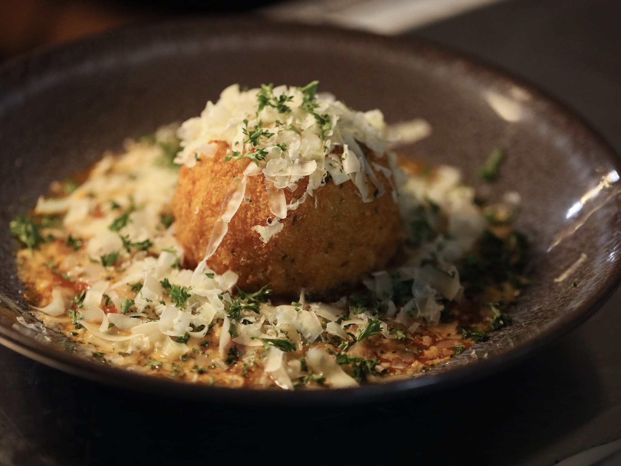 a bowl of food with grated cheese