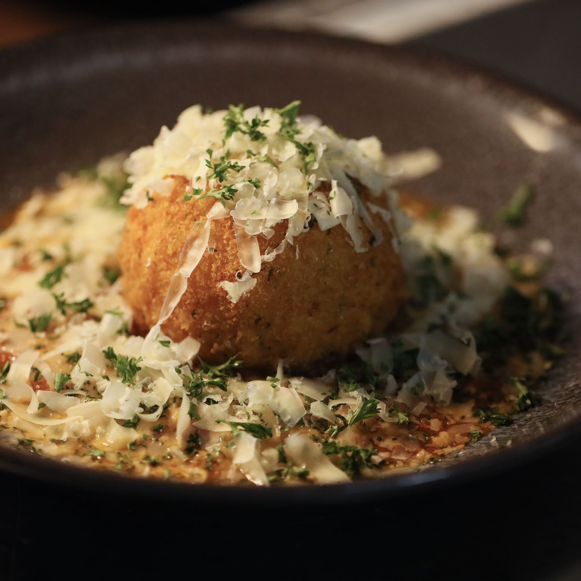 a bowl of food with grated cheese