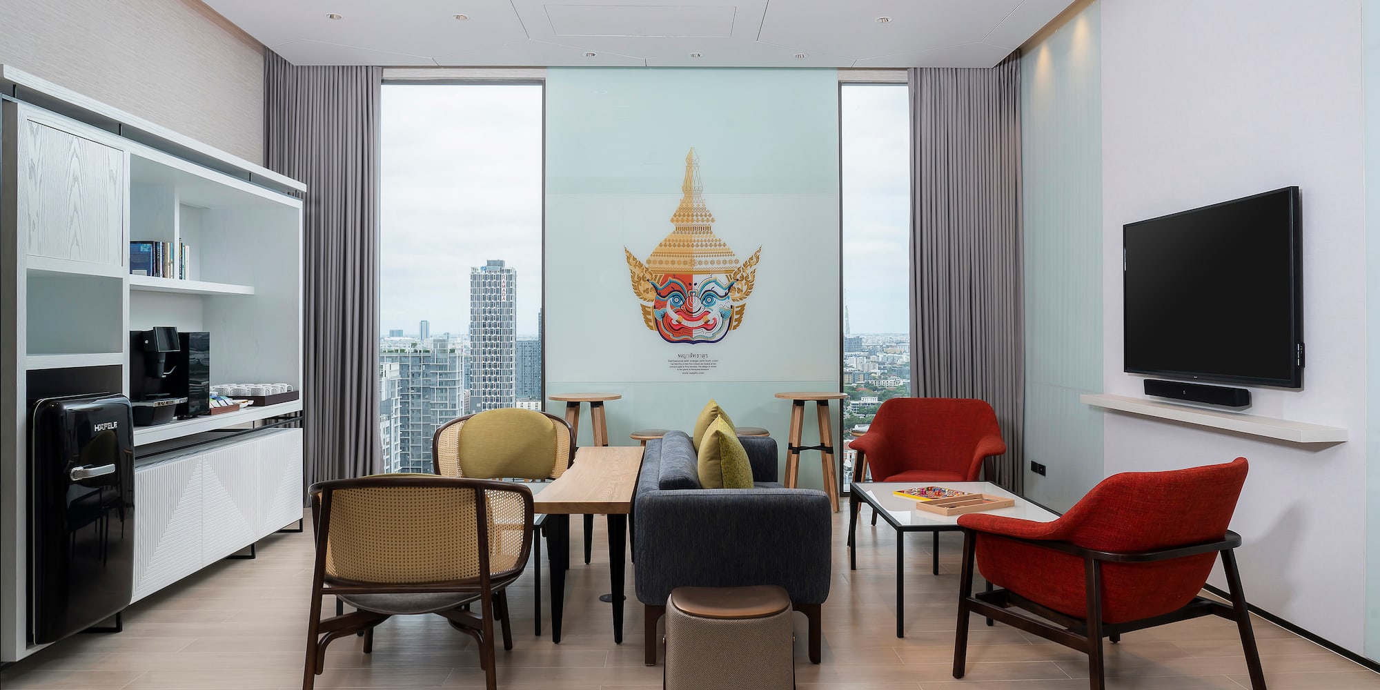 a room with a tv and tables