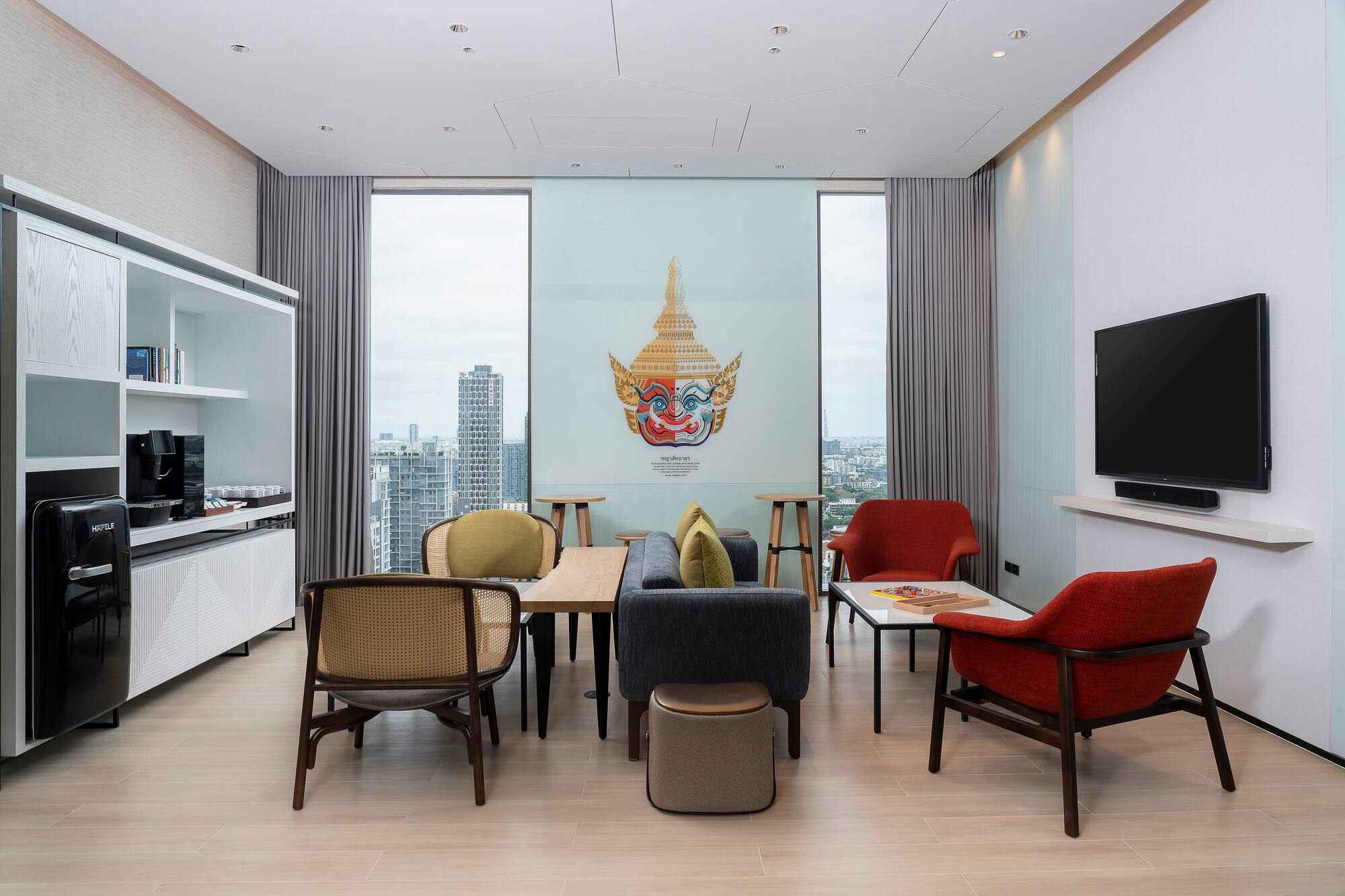 a room with a tv and tables
