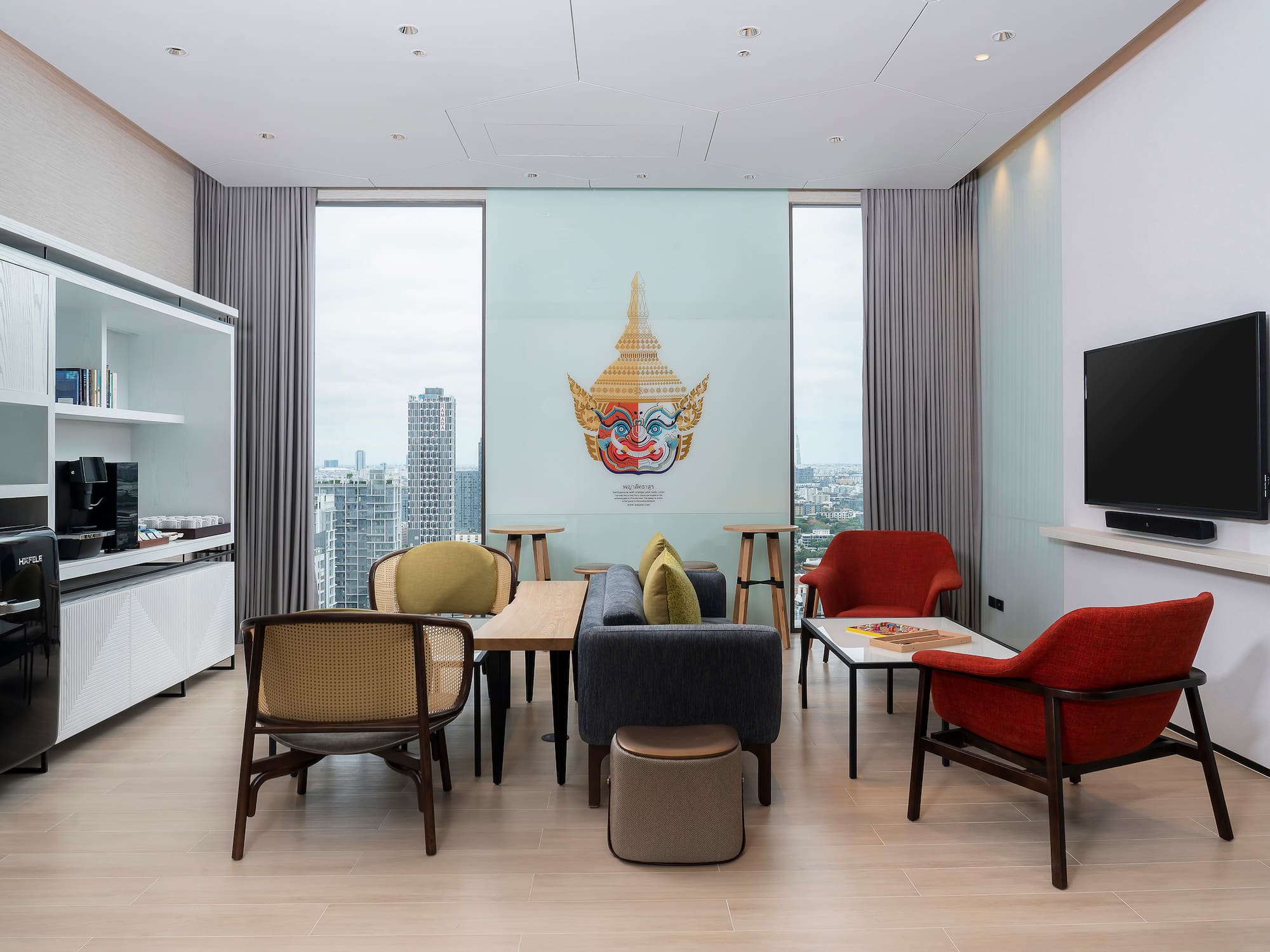 a room with a tv and tables