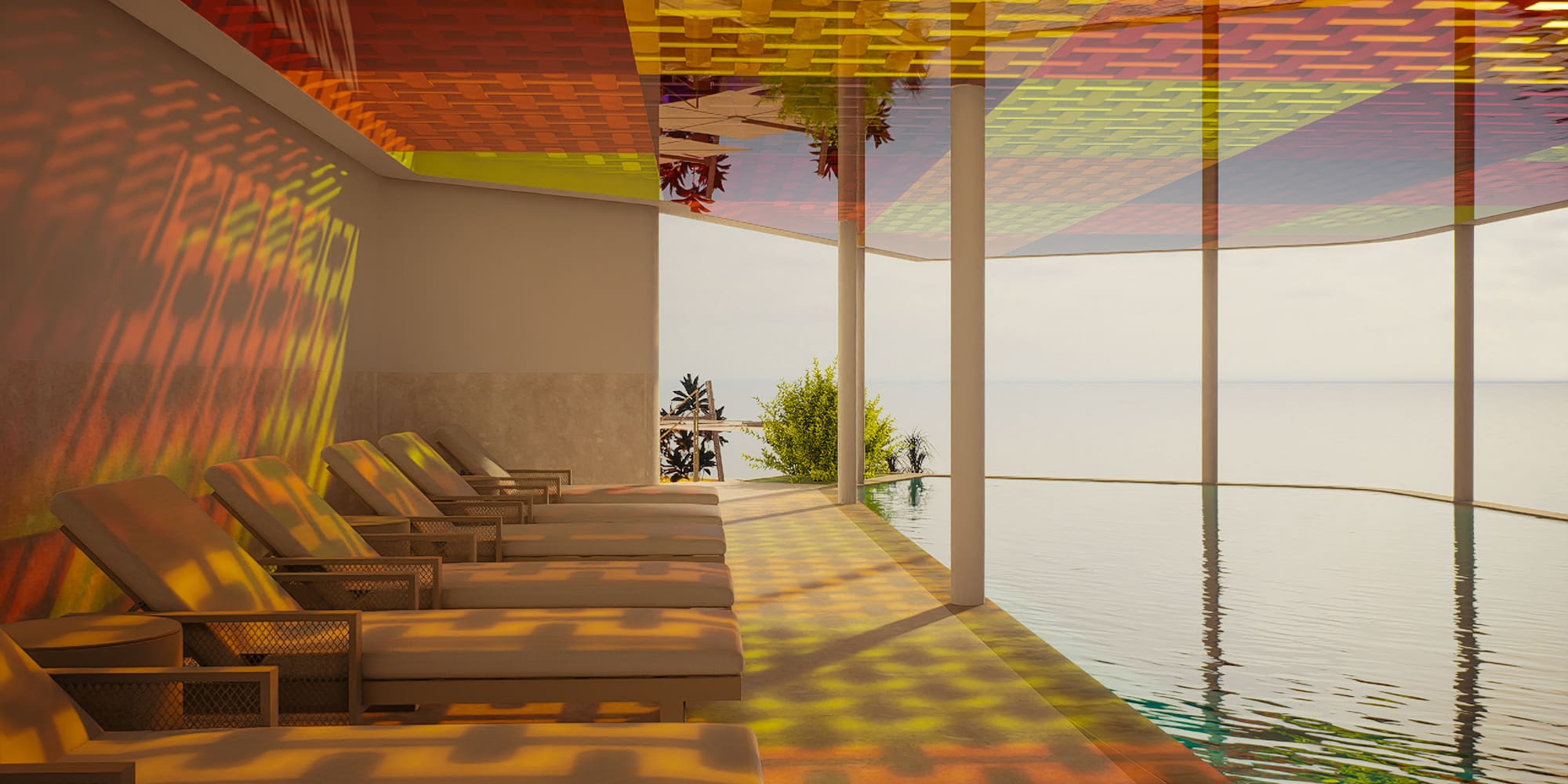 a pool with chairs and a view of the ocean