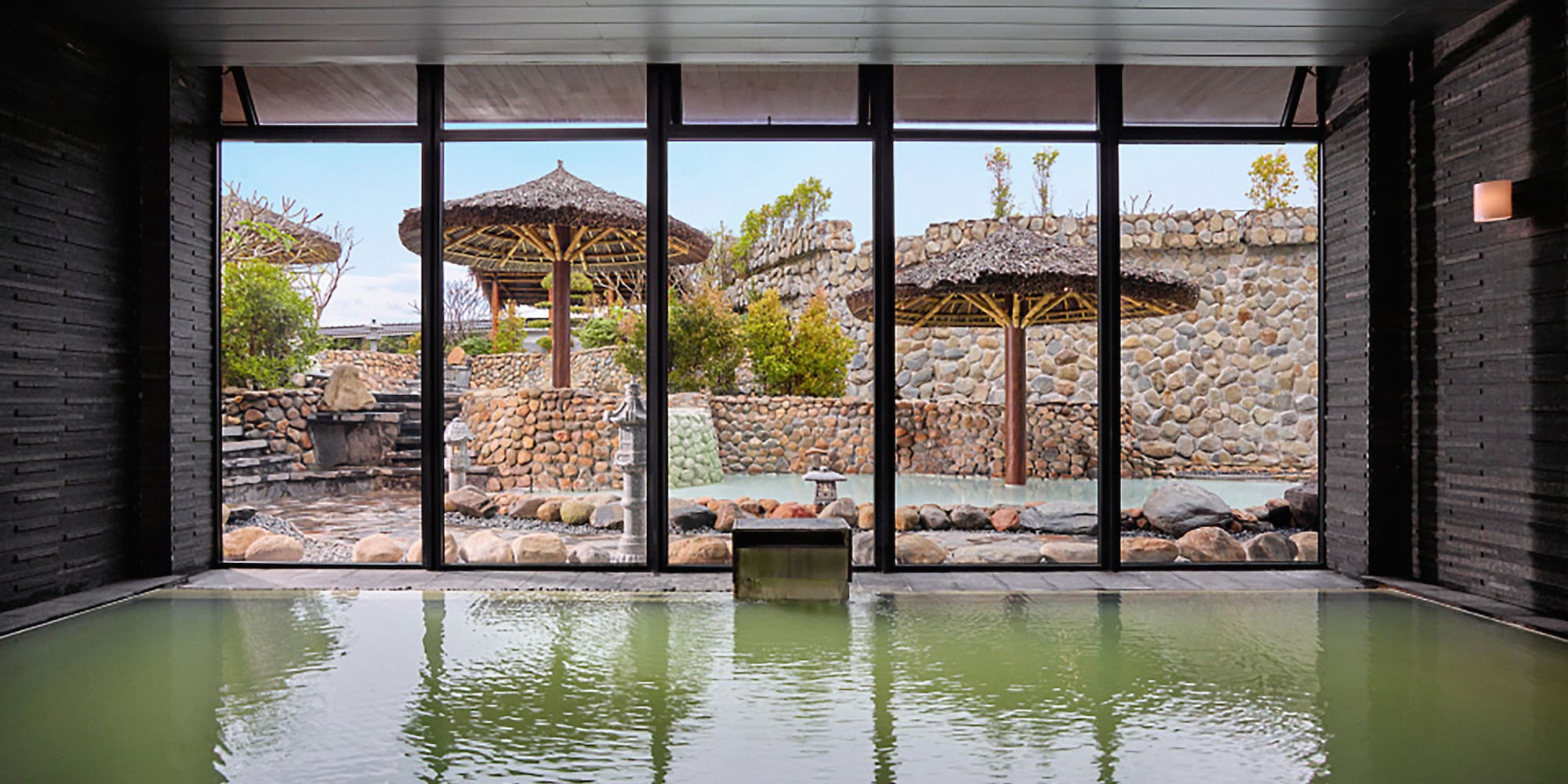 a large indoor pool with a large window