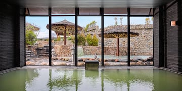 a large indoor pool with a large window