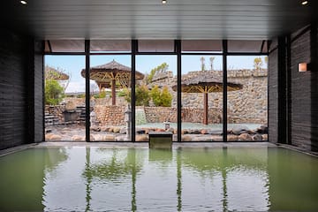 a large indoor pool with a large window