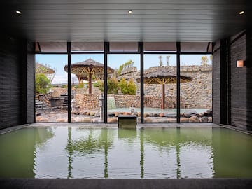 a large indoor pool with a large window