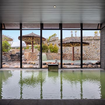 a large indoor pool with a large window