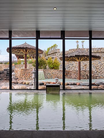 a large indoor pool with a large window