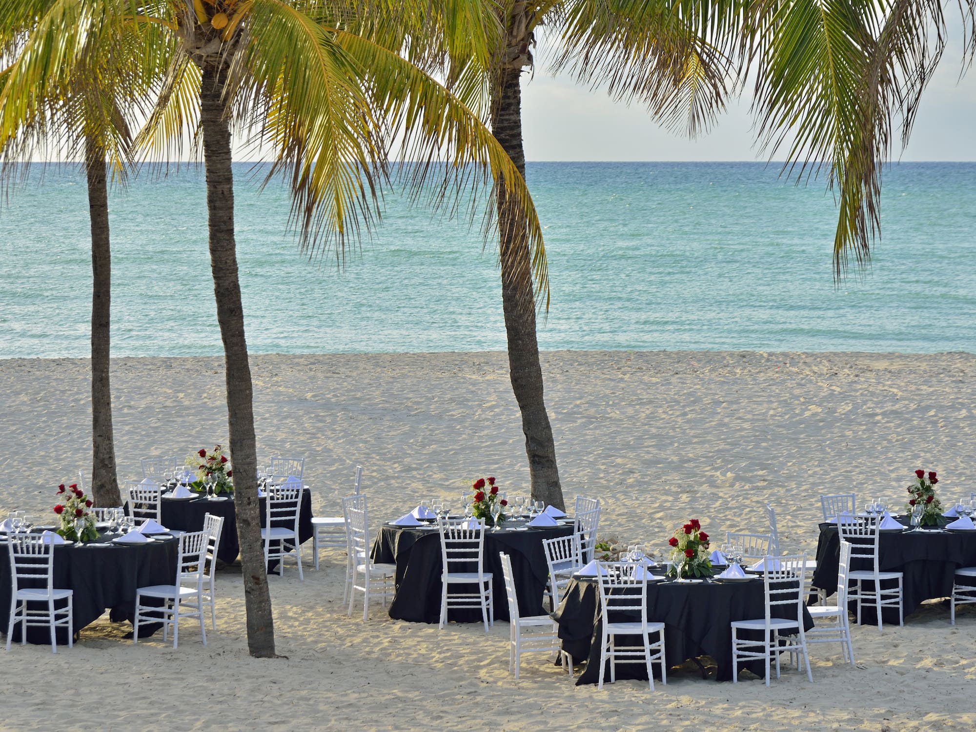 a group of tables on a beach