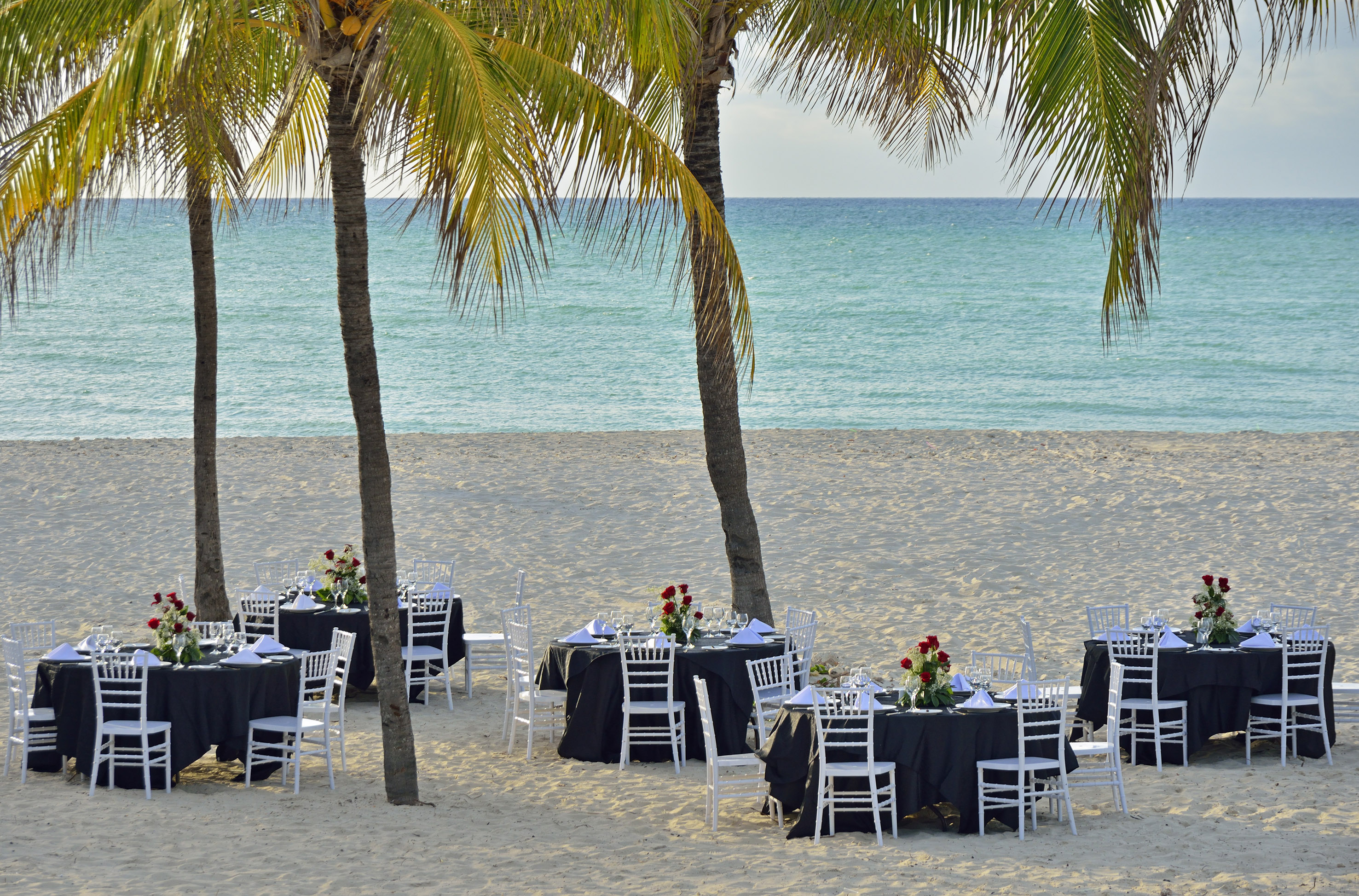 a group of tables on a beach