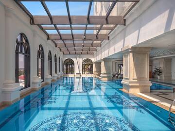 a indoor swimming pool with a glass roof