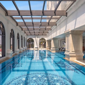 a indoor swimming pool with a glass roof