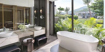 a bathroom with a tub and sink