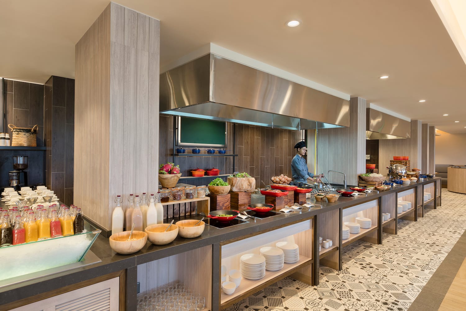 a kitchen with a chef cooking