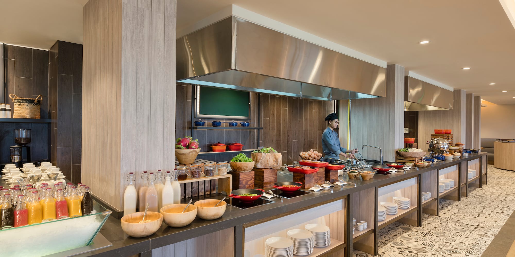 a kitchen with a chef cooking