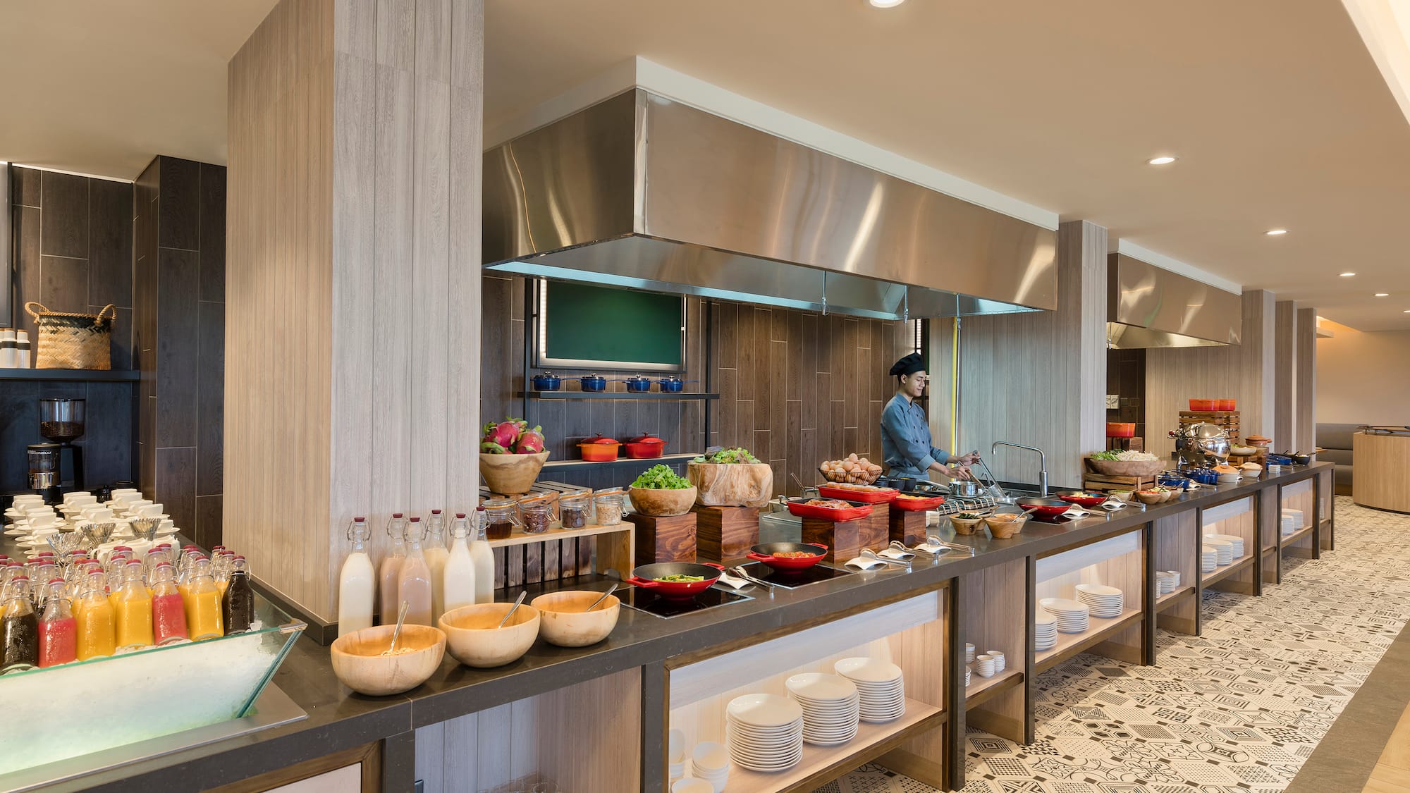 a kitchen with a chef cooking