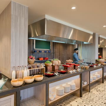 a kitchen with a chef cooking
