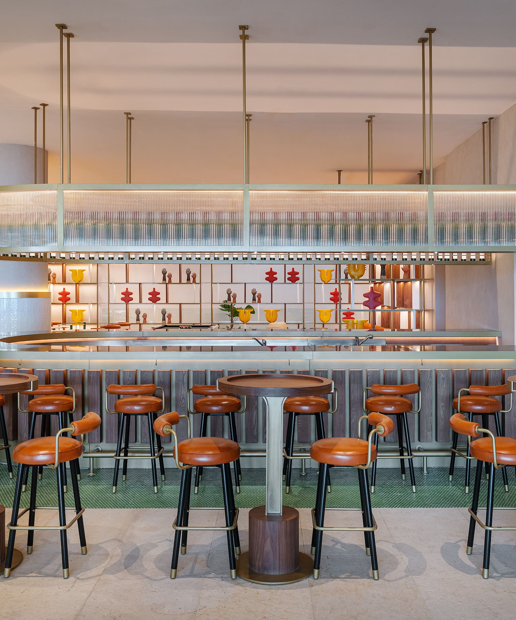 a bar with stools and a counter