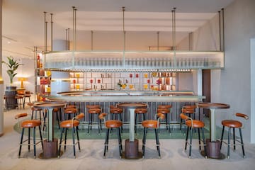 a bar with stools and a counter